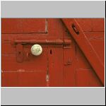 knob and bolt on red door